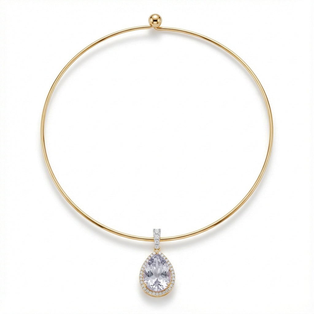 Gold necklace with a teardrop-shaped diamond pendant on a white background
